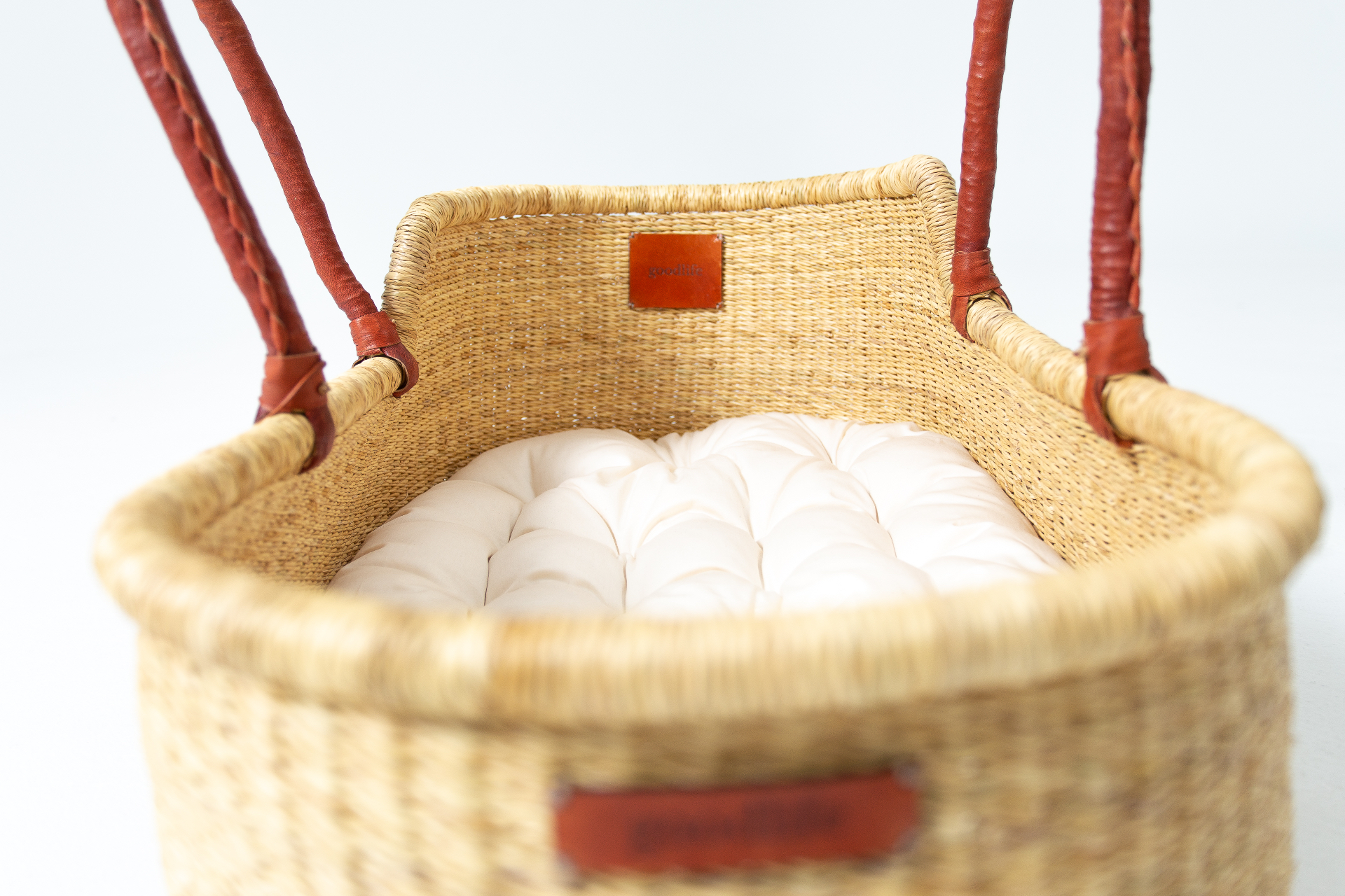 Top-down view inside the handwoven Heirloom showing the cushioned interior